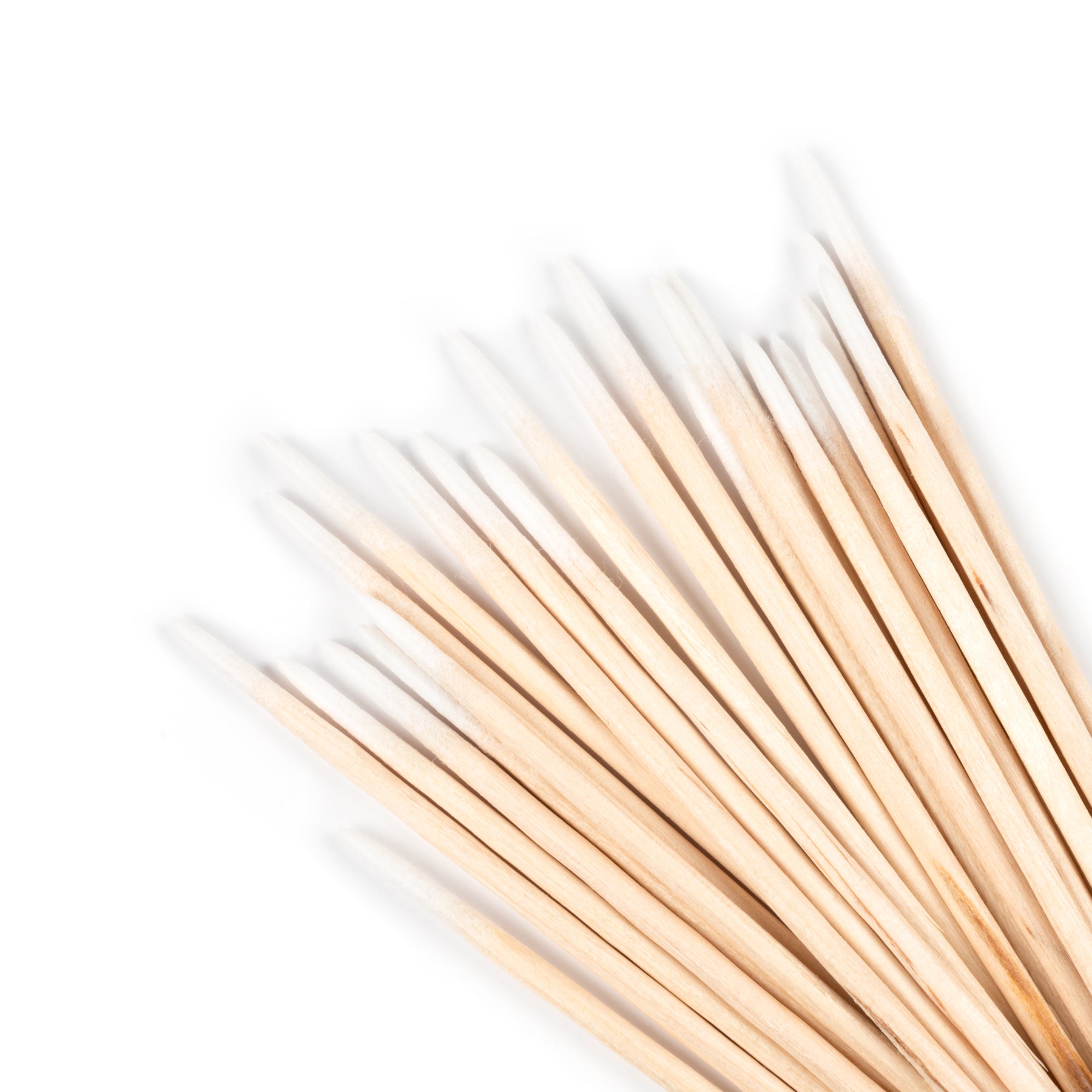 Cotton tipped Wooden manicure sticks on a white background