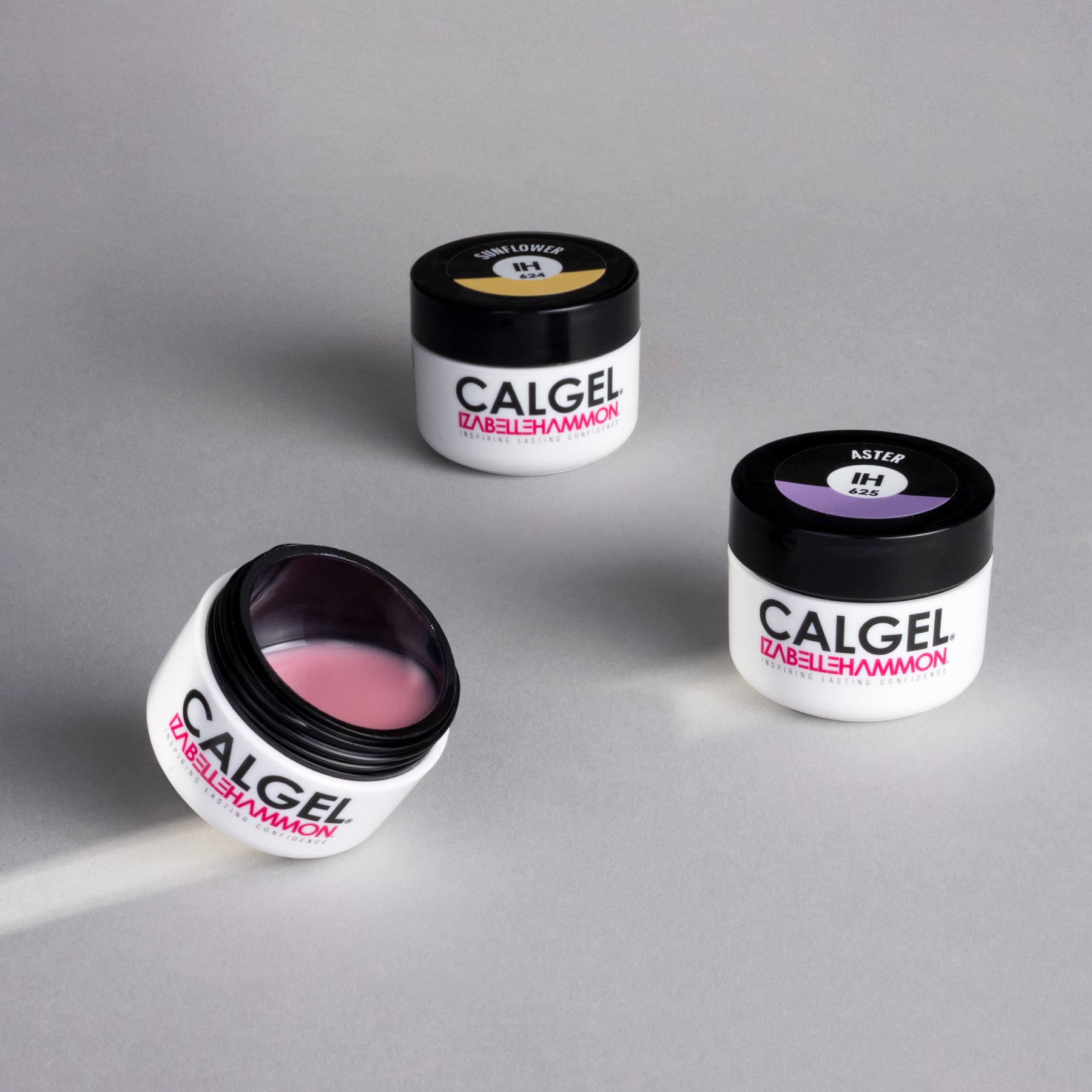Three jars of Calgel nail gel pots on a gray background