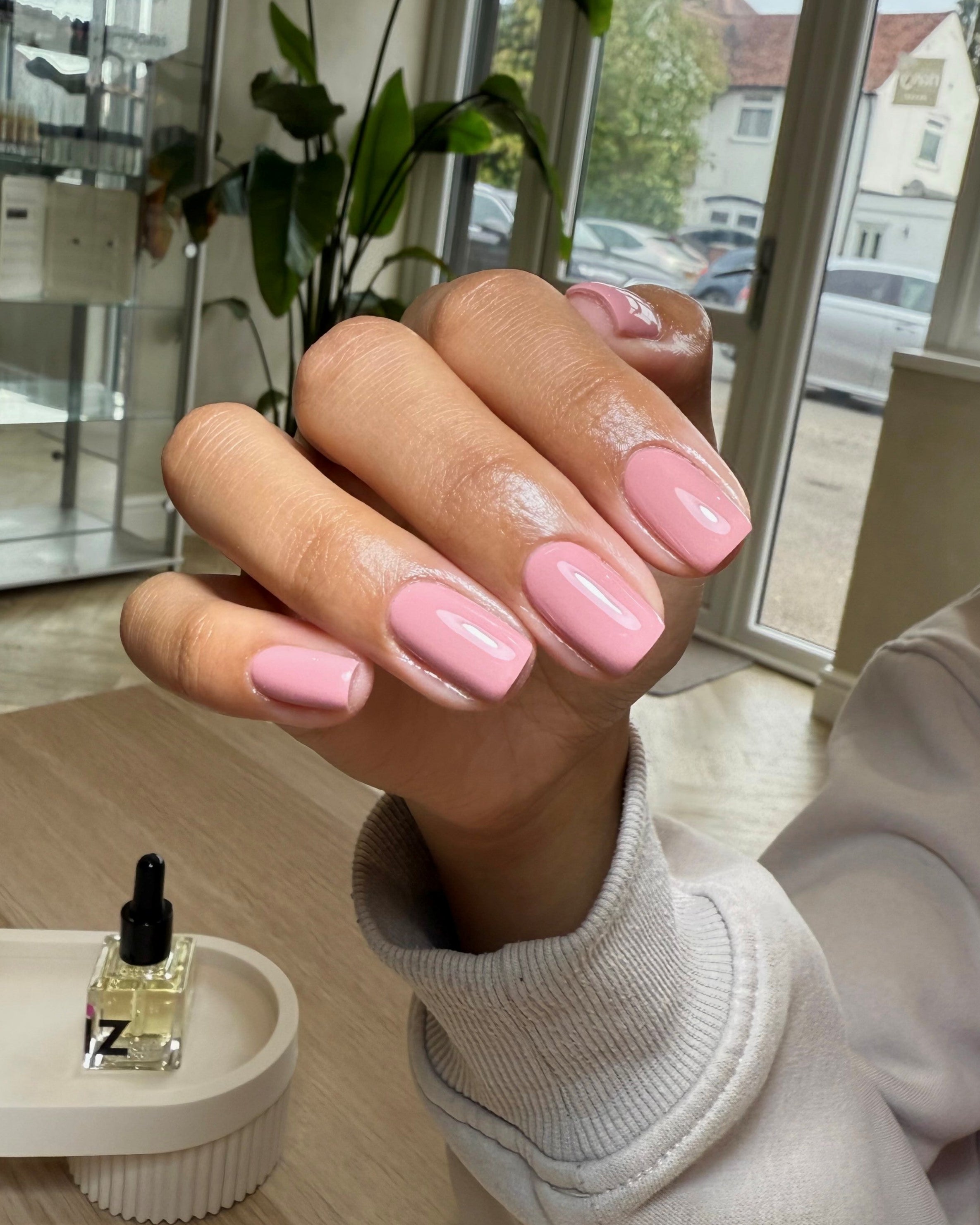 Hand with dusky pink gel nails in Poetic Heart available in Calgel and Pro Colour