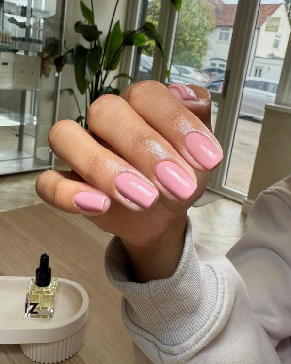 Hand with dusky pink gel nails in Poetic Heart available in Calgel and Pro Colour