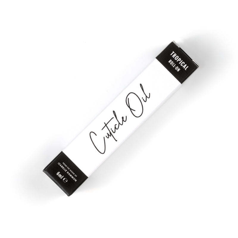 Box of cuticle oil with 'Tropical' label on a white background
