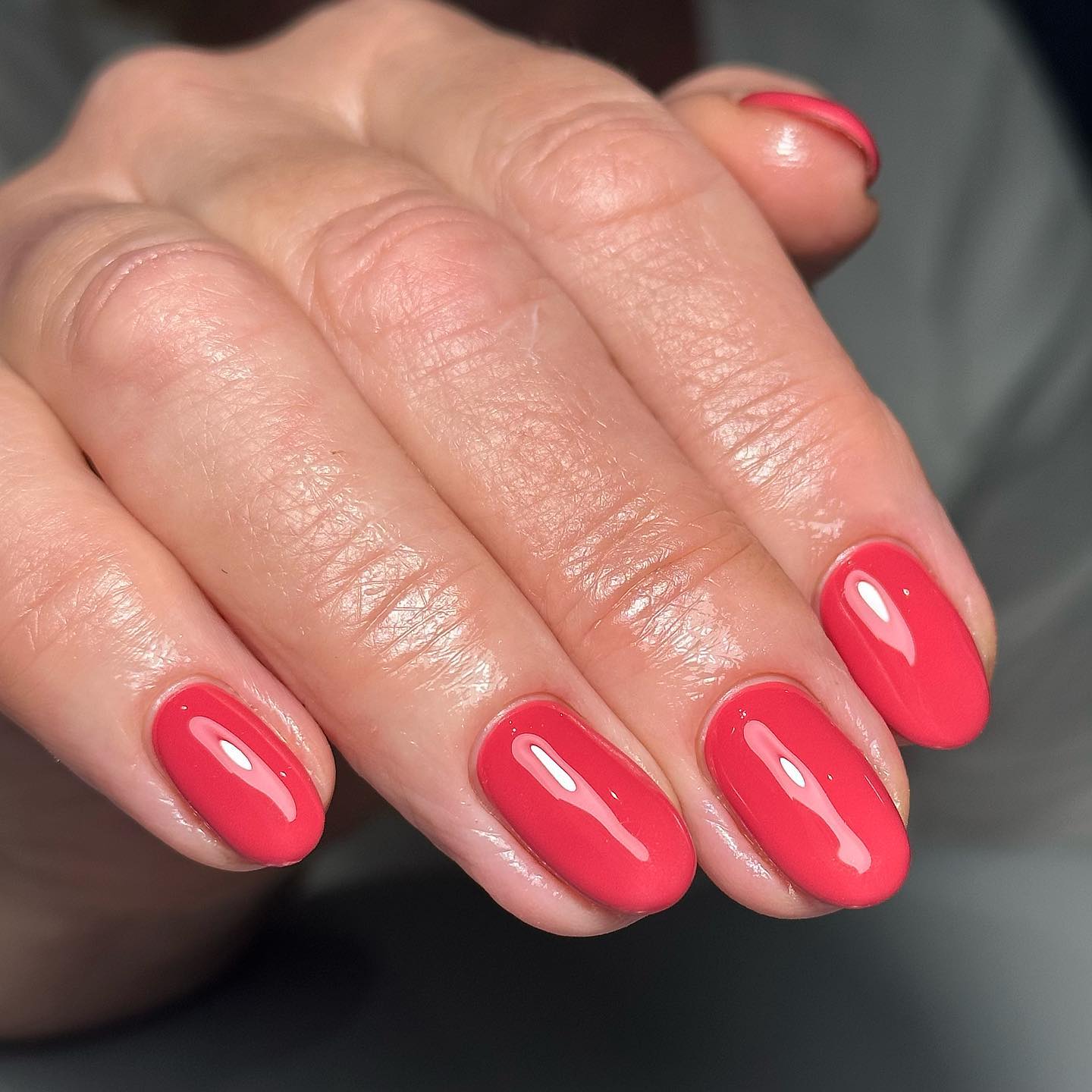 Warm shiny red gel nails