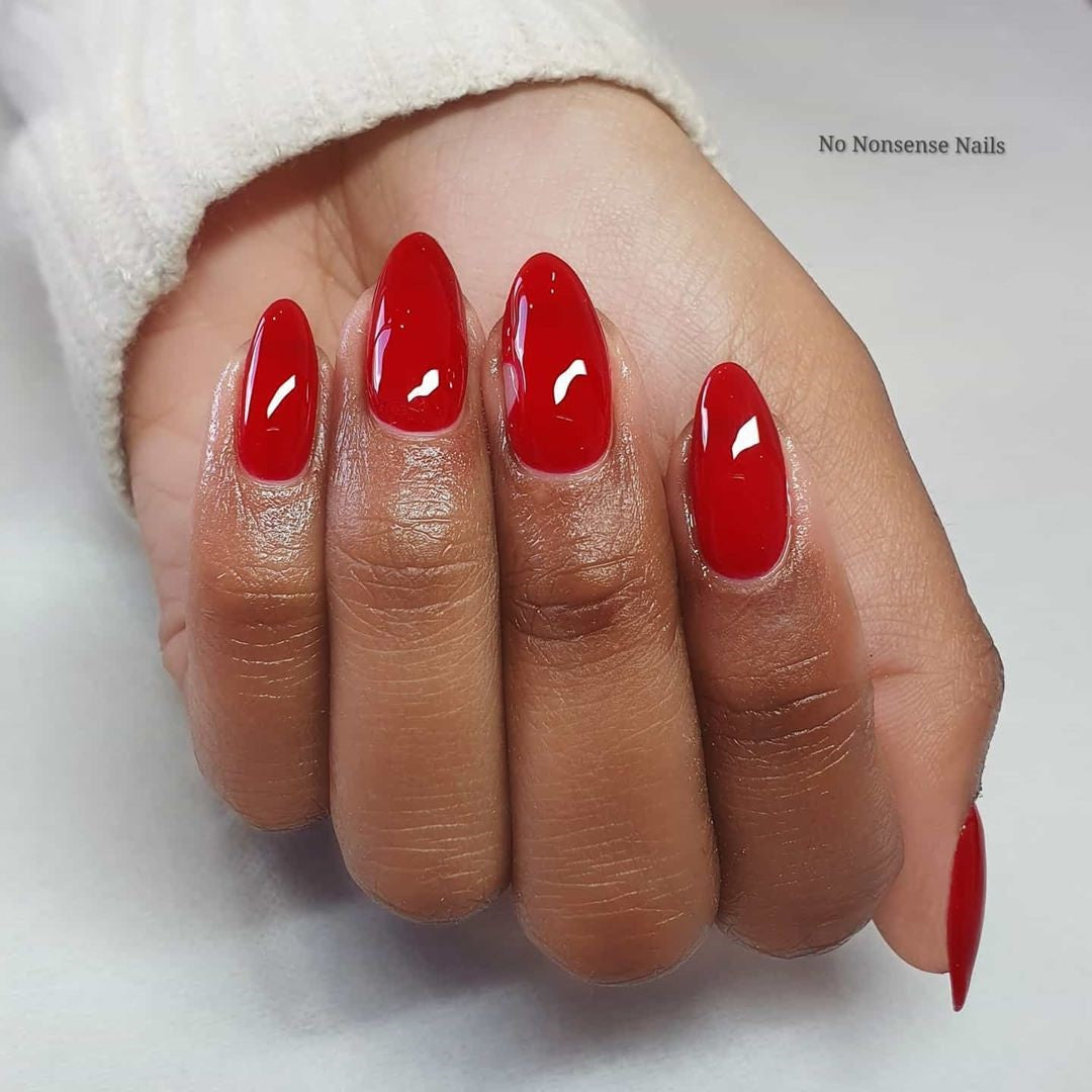 British Red IZ925 red gel manicure on natural almond nails